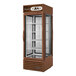 A brown True refrigerated glass door pass-through merchandiser.