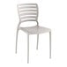 A white plastic Lancaster Table & Seating side chair with a slatted back.