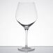 A close-up of a clear Stolzle Exquisit Burgundy wine glass.
