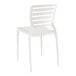 A white resin side chair with slats on the back.