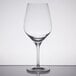 A Stolzle Exquisit wine glass on a table.