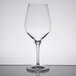A Stolzle Exquisit Bordeaux wine glass on a table.