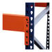 A close-up of a blue and orange metal shelf on a rack.