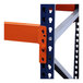 A close-up of a metal Interlake Mecalux pallet rack shelf with blue and orange pieces.