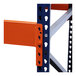 A close-up of blue and orange metal beams for an Interlake Mecalux heavy-duty bolted teardrop pallet rack.