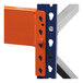 An orange Interlake Mecalux heavy-duty pallet rack beam with blue and orange metal ends.