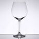 A close-up of a clear Stolzle Burgundy wine glass.