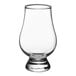 A clear Stolzle Glencairn whiskey glass with a base.