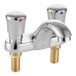 An American Standard chrome deck-mount metering faucet with two handles.