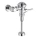 An American Standard chrome plated metal urinal flush valve.