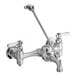 An American Standard chrome wall-mount utility faucet with two long silver handles and a vacuum breaker spout.