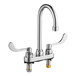 An American Standard chrome deck-mount lavatory faucet with two wrist blade handles.