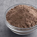 A bowl of Pillsbury Chocolate Creme Cake Base mix powder.