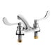 A close up of a silver American Standard deck-mount faucet with two wrist blade handles.