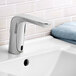 An American Standard chrome NextGen Selectronic lavatory faucet on a sink.