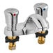 An American Standard deck-mount metering faucet with two chrome handles.