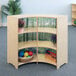 A Whitney Brothers wood cabinet with shelves holding toys.