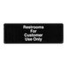 A black sign with white text that reads "Restrooms For Customer Use Only"