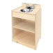 A Whitney Brothers wooden toddler sink with a silver faucet.