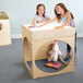 Two girls playing with a Whitney Brothers Creative Cube with LED light box table.