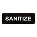 A black sign with white letters that says "Sanitize" by Lavex.