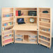 A Whitney Brothers Melamine Hideaway Organization Station cabinet with a laptop on top.