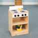 A Whitney Brothers white wooden toddler stove with a pot and a pan on top.