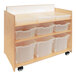A wooden shelf with plastic bins on wheels.