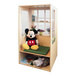 A Whitney Brothers wood window seat with a cushion and shelves in a room with a stuffed Mickey Mouse doll on a shelf.