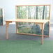 A Whitney Brothers wood kids table with a nature view of a forest on it.