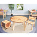 A Whitney Brothers round wooden table with a tree trunk cut out of it.