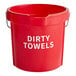 A red Lavex bucket with white text that says "Dirty Towels" on it.