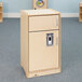 A Whitney Brothers natural wooden toddler refrigerator with a silver handle.