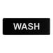 A black sign with white text that says "Wash"