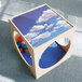 A Whitney Brothers toddler play cube with a blue sky and clouds on top.