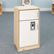 A white wooden Whitney Brothers toddler refrigerator with a white door.