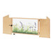 A Whitney Brothers wooden divider gate with a picture of grass and flowers on it.