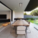 A white Bromic Heating electric patio heater on an outdoor dining table.