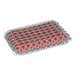 A close-up of a stainless steel chainmail scrub pad with red and white squares.