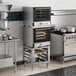 A large commercial kitchen with a double stacked Cooking Performance Group electric convection oven.
