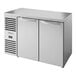 A stainless steel True back bar refrigerator with two doors.