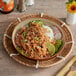 A bowl of food with Better Balance Plant-Based Vegan Shredded Meat on a table.