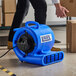 A blue Lavex 3-speed compact air mover with GFCI power outlets designed for drying floors and carpets.