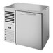 A stainless steel True back bar refrigerator with a closed door.