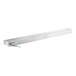 A long white metal shelf with a rectangular light and wires attached.