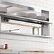 A ServIt double strip warmer on a counter in a professional kitchen.