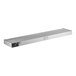 A white rectangular metal strip with a long rectangular metal object with buttons.