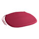 A Lancaster Table & Seating merlot red round cushion with ties.