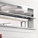 A ServIt double strip warmer on a shelf in a commercial kitchen.