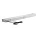 A white rectangular metal strip with a black cord attached.
